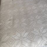 White cotton bedspread, crocheted sofa throw with star patterns