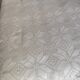 White cotton bedspread, crocheted sofa throw with star patterns