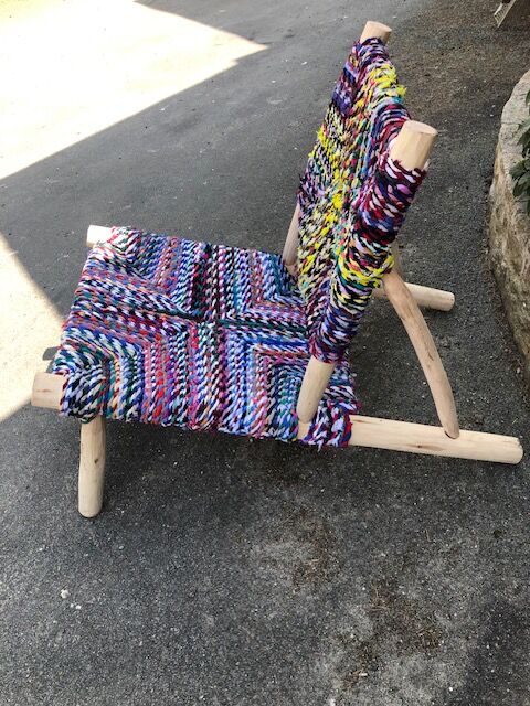 Wooden armchair braiding multicolored fabrics
