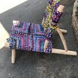 Wooden armchair braiding multicolored fabrics