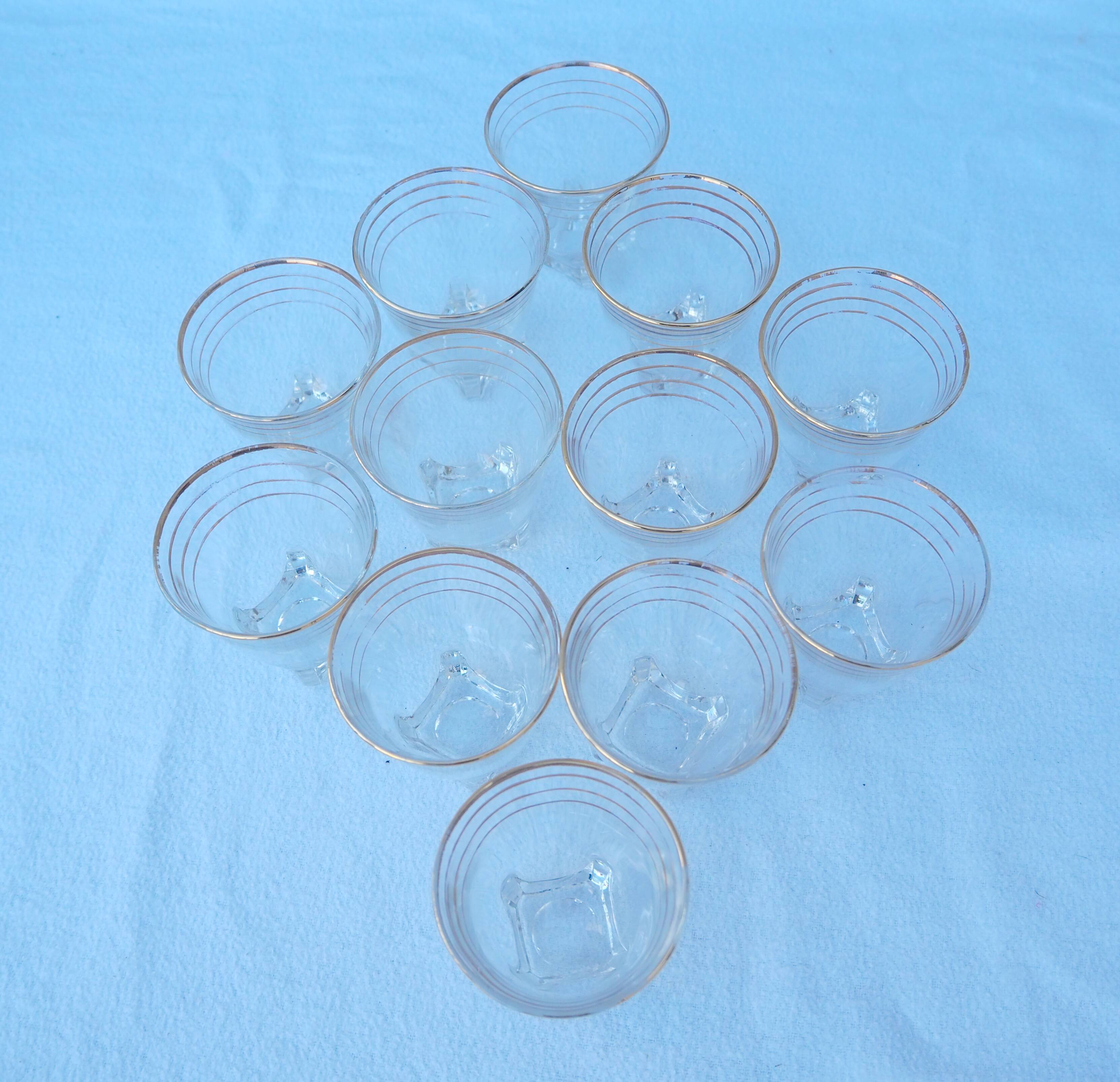 12 liqueur glasses with its golden rim from the 1950s-1960s