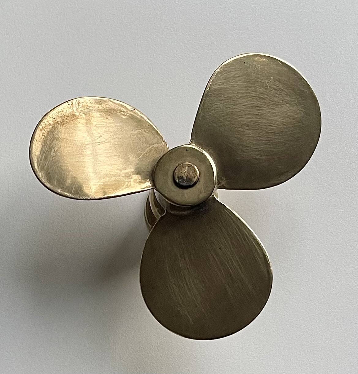 Propeller candle holder in solid brass