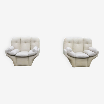 Pair of leather “space age” armchairs. Cream colour". Circa 1970.