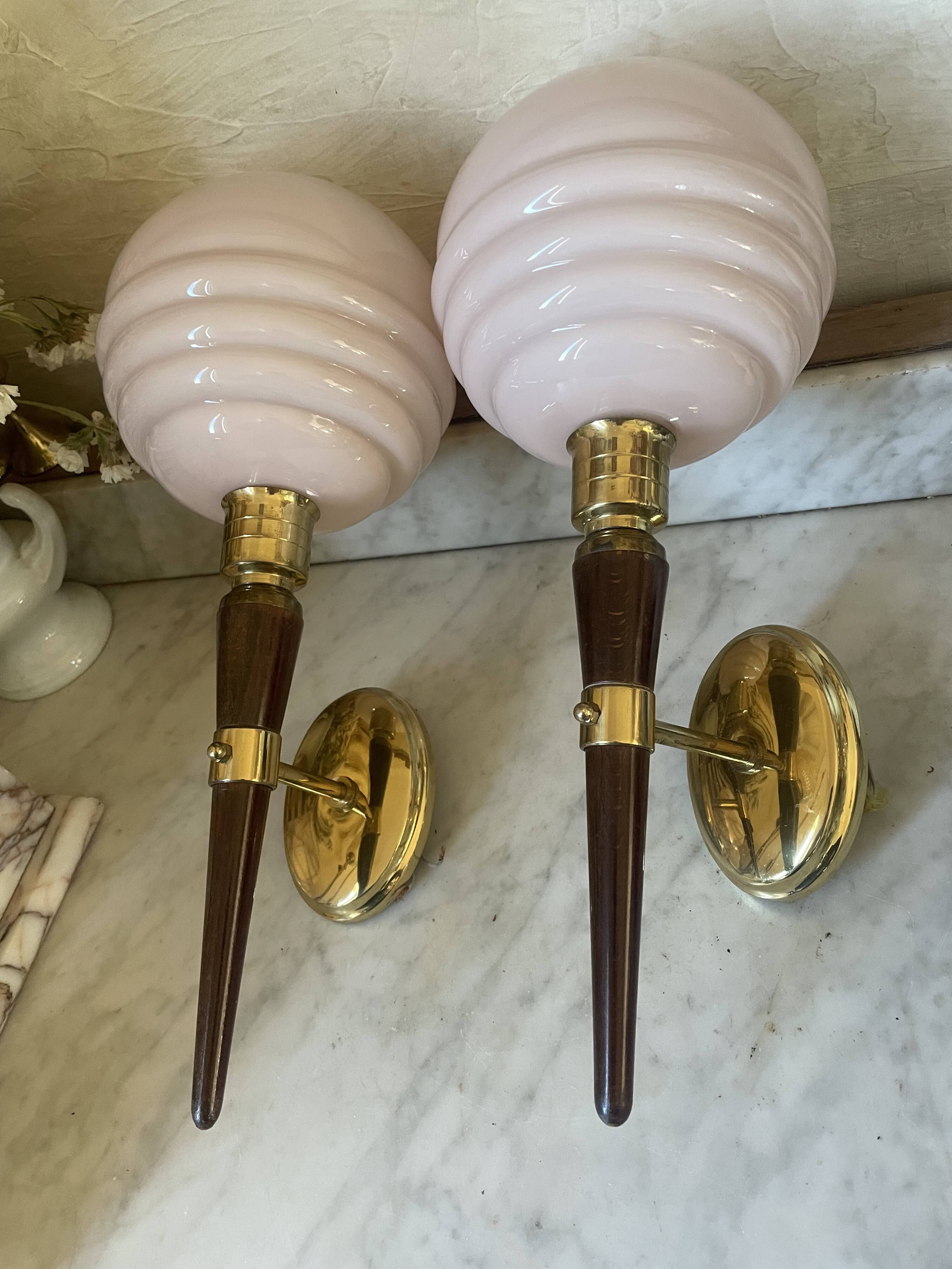 Pair of wall lights in wood, brass, and pink opaline.