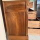 Antique carved wooden dressing table with marble and tilting oval mirror.