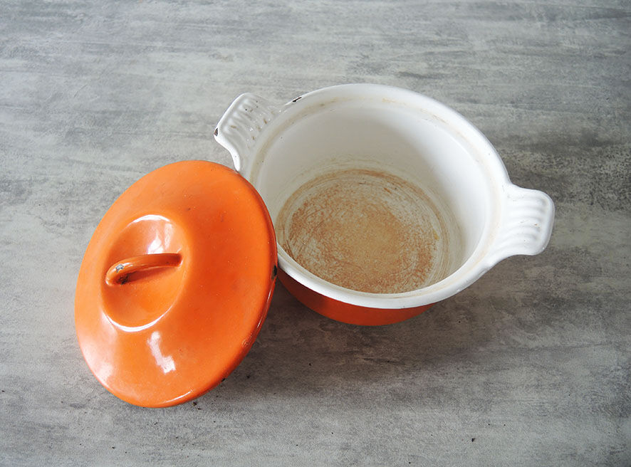Old cast iron pot enamelled orange Le Creuset