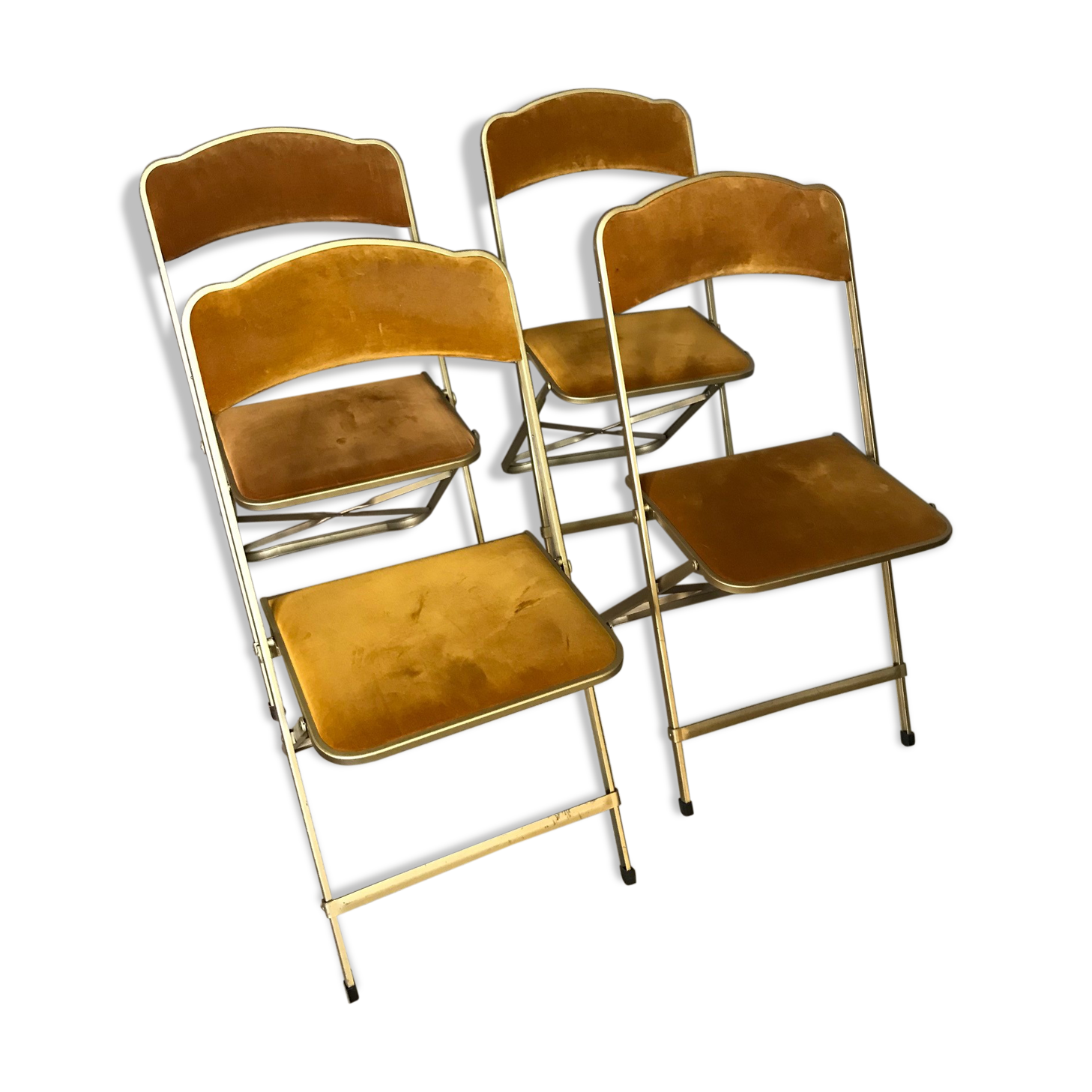 Four folding velvet and brass chairs