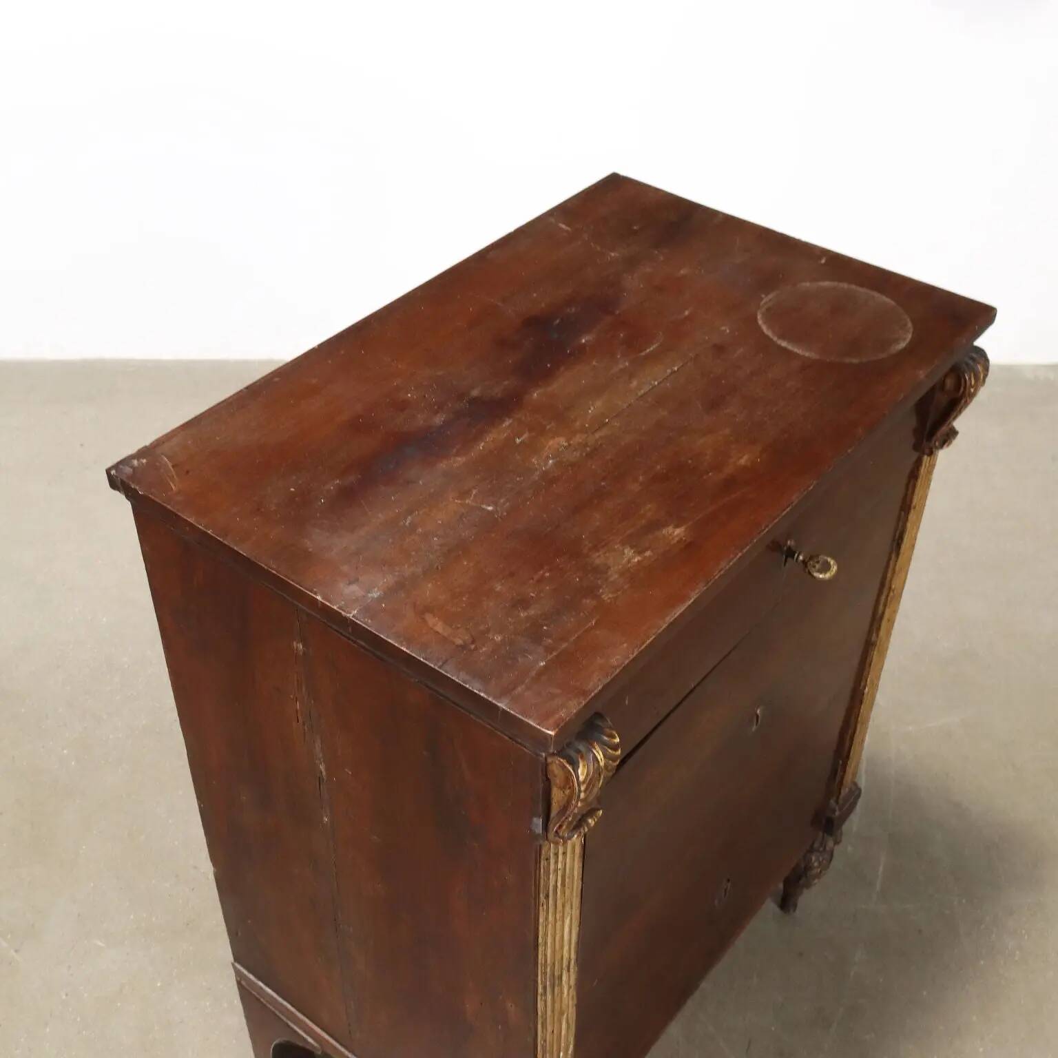 Empire bedside table in walnut with drawer, Italy, 19th century.