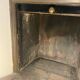 Marble fireplace surround with closed hearth frame.