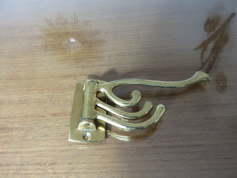 70s brass swivel coat door