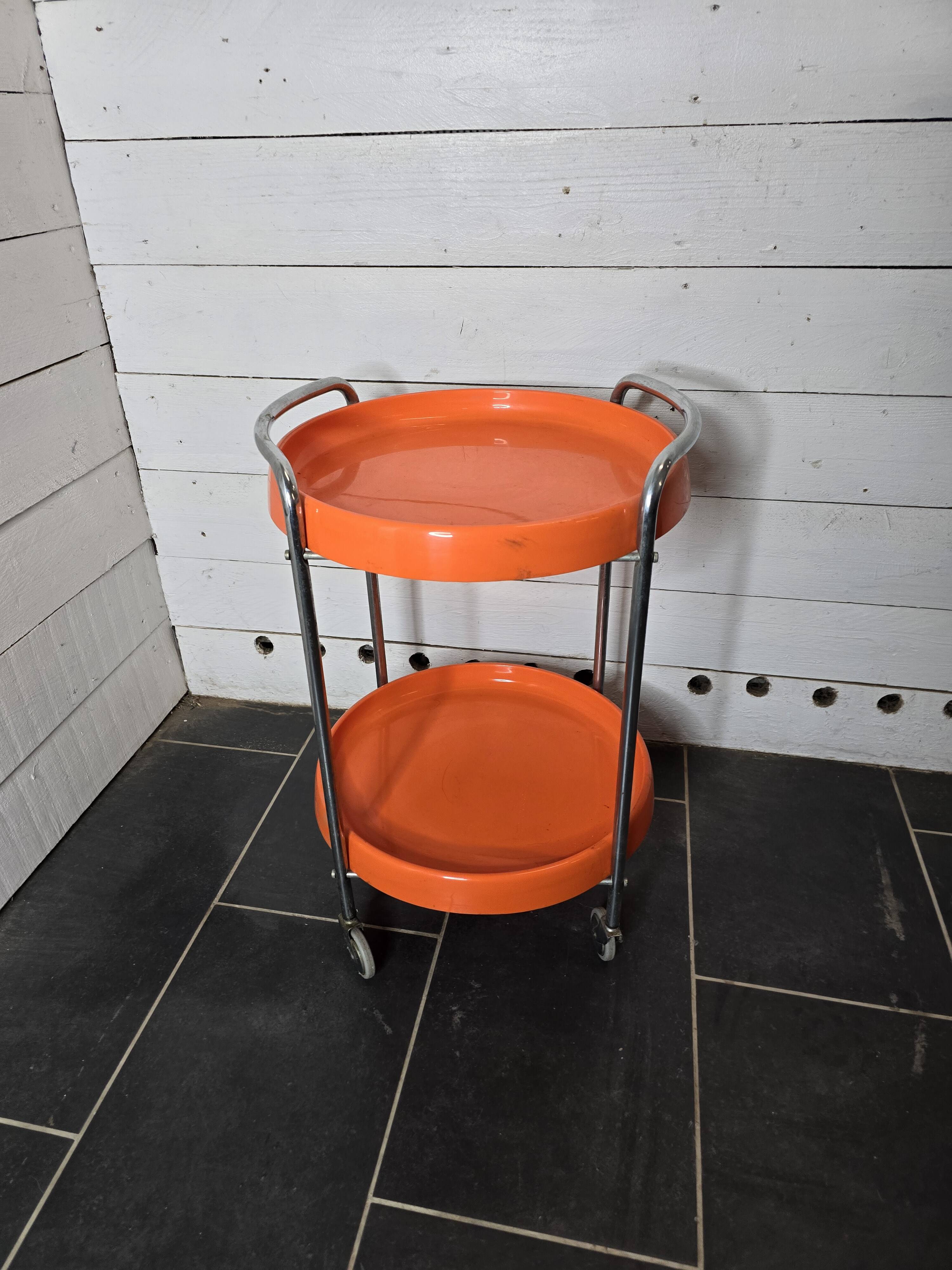 Orange trolley on wheels from the 70s