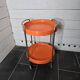 Orange trolley on wheels from the 70s