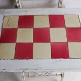 Small antique folding wooden dressing table with tiles and a mercury mirror.