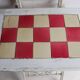 Small antique folding wooden dressing table with tiles and a mercury mirror.