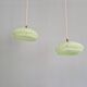 Pair of Art Deco light fixtures in light green speckled glass, 1930s.