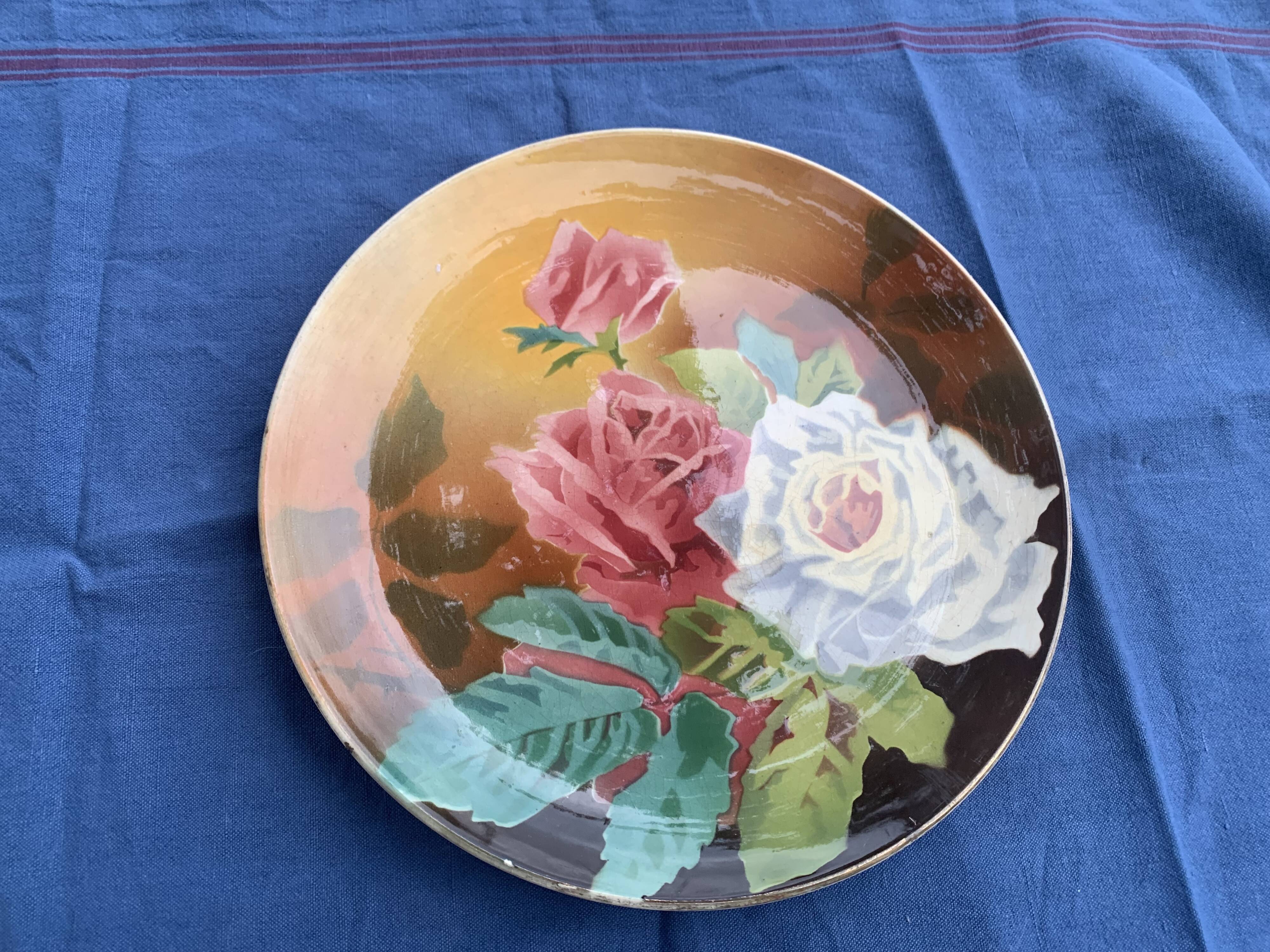 Plate with iron rose motifs, hb, Choisy le roi art deco