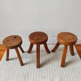 3 wooden tripod stools