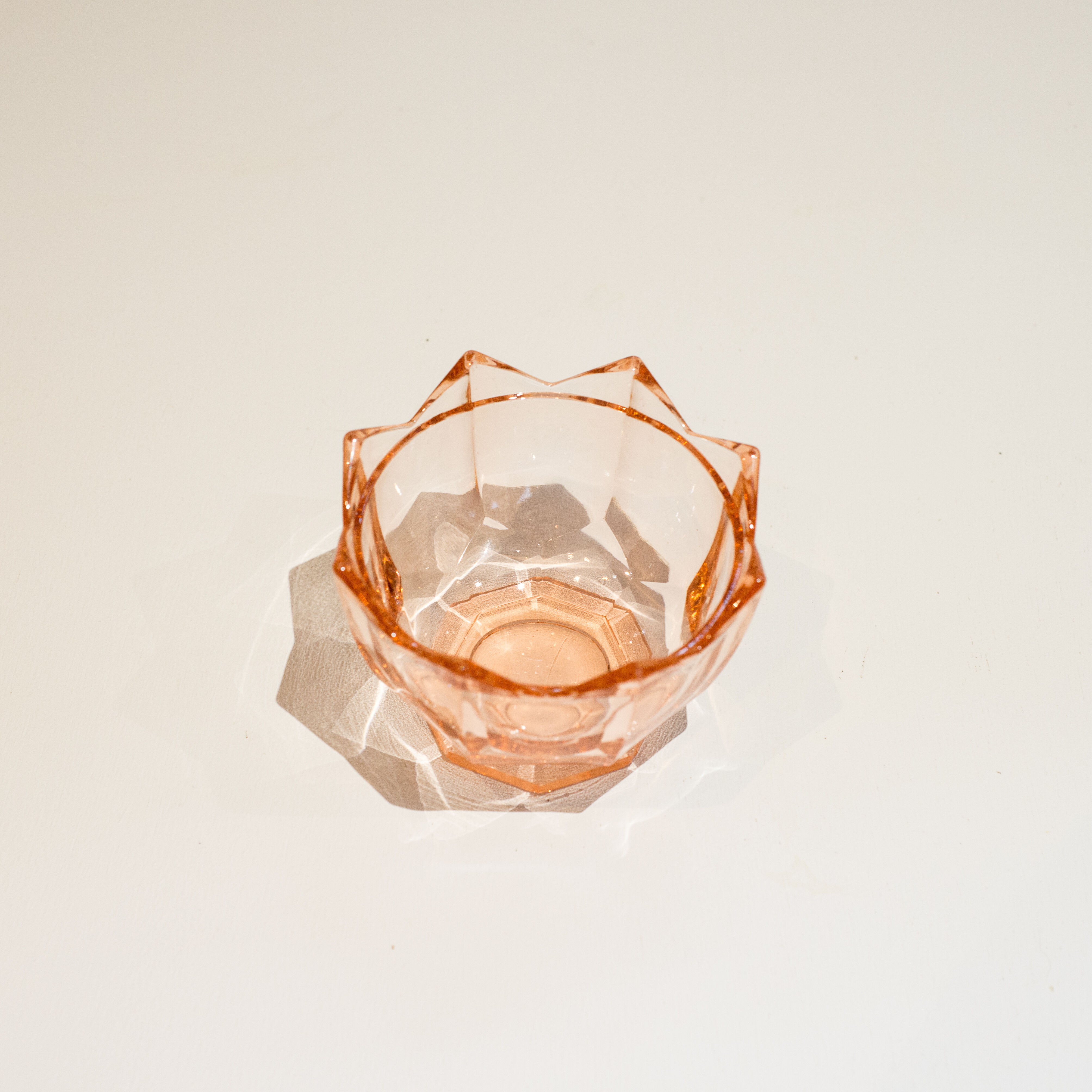 Empty pink glass jar pocket