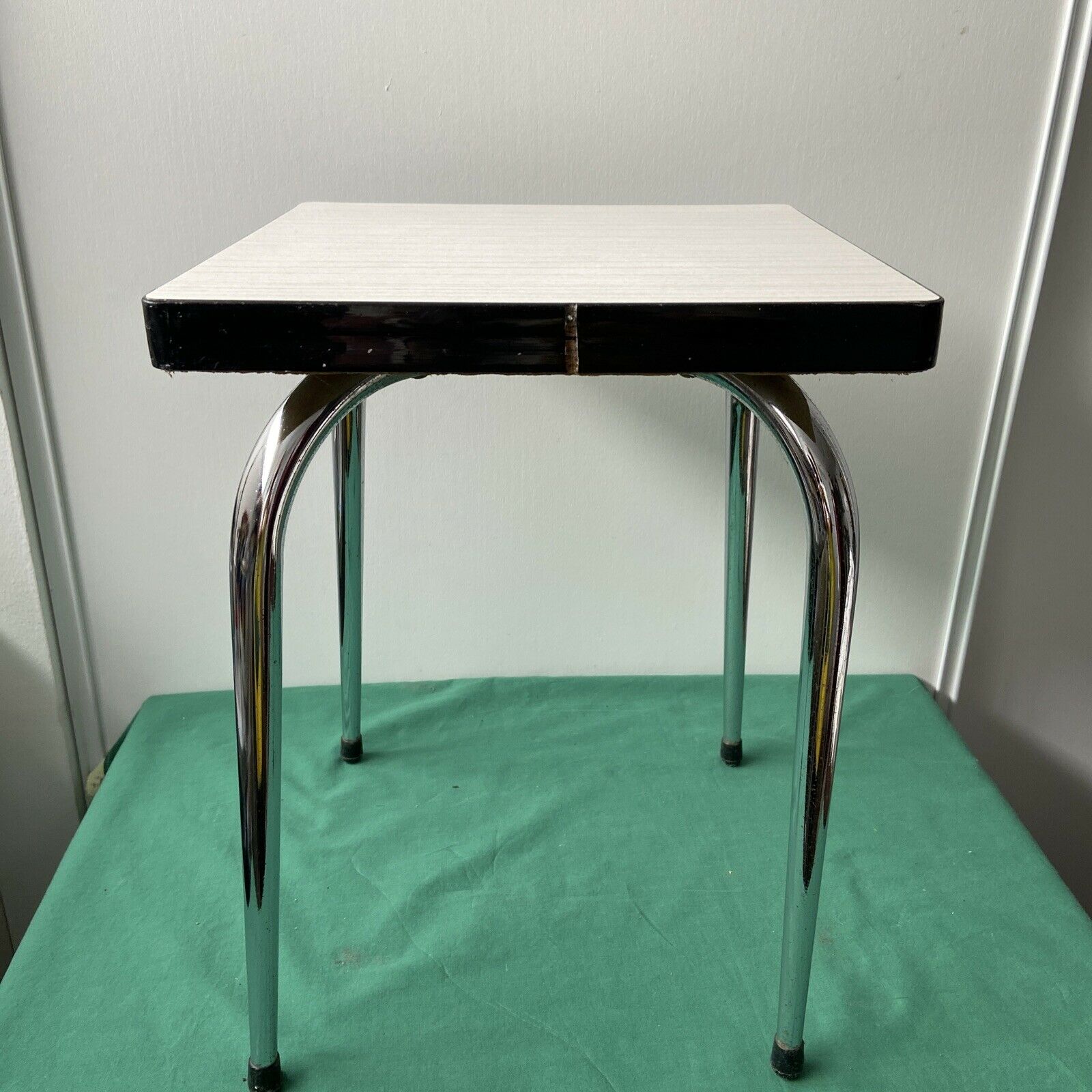 White stool in formica and metal