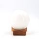 Wall light in pine wood with opaque white glass globe, 1980s