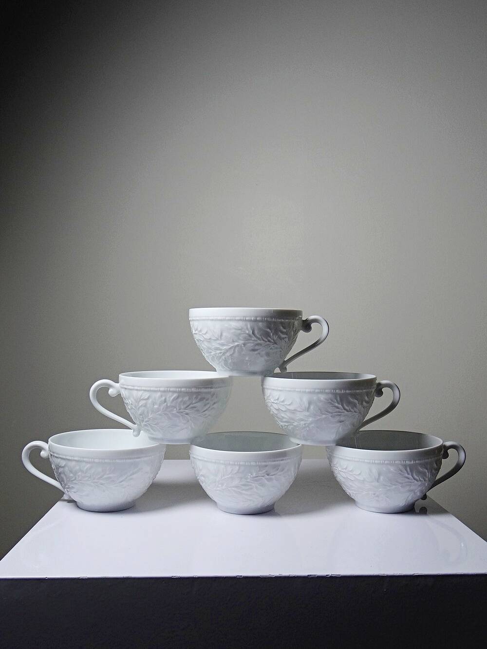 Set of 6 Bernardaud Limoges Louvre model white porcelain cups.