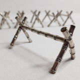 Set of six knife holders in silver metal in imitation of bamboo