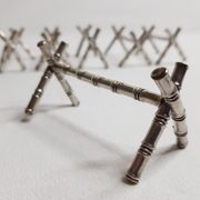 Set of six knife holders in silver metal in imitation of bamboo