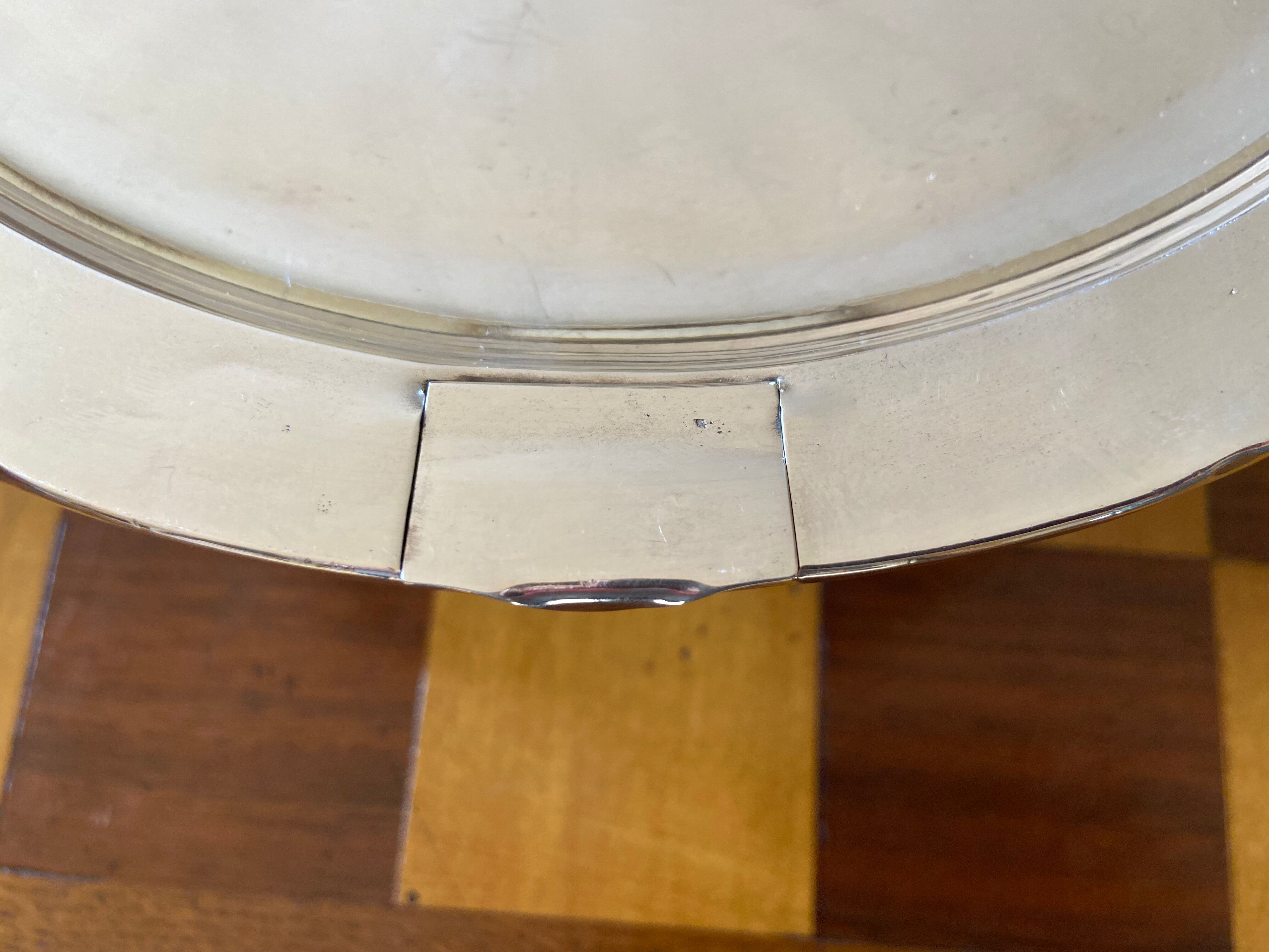 Old silver metal trivet