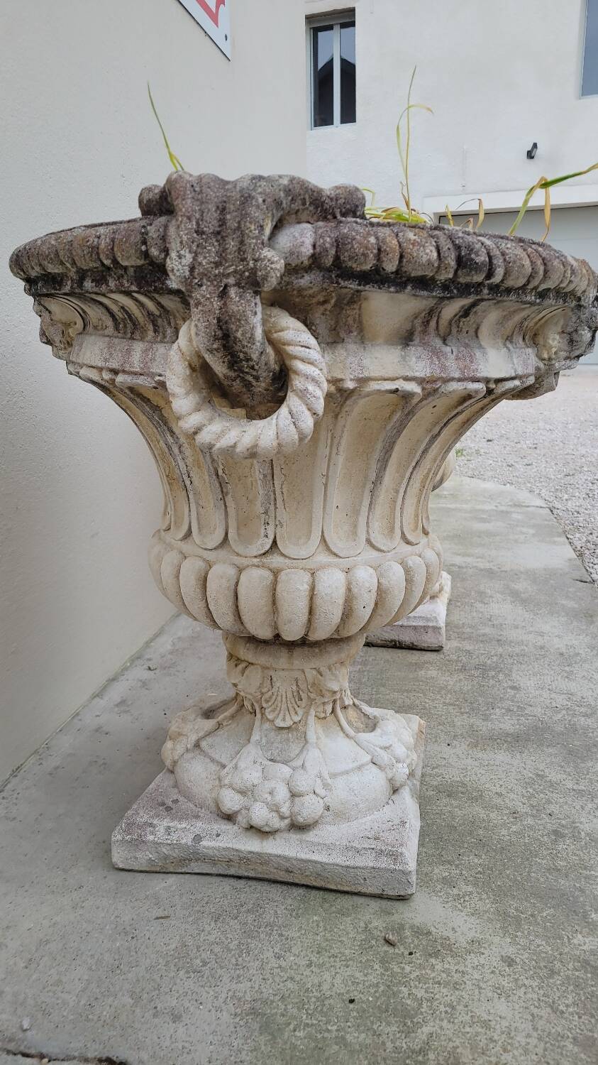 Pair of planter vases decorated with faces in reconstituted stone 1950s