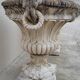 Pair of planter vases decorated with faces in reconstituted stone 1950s