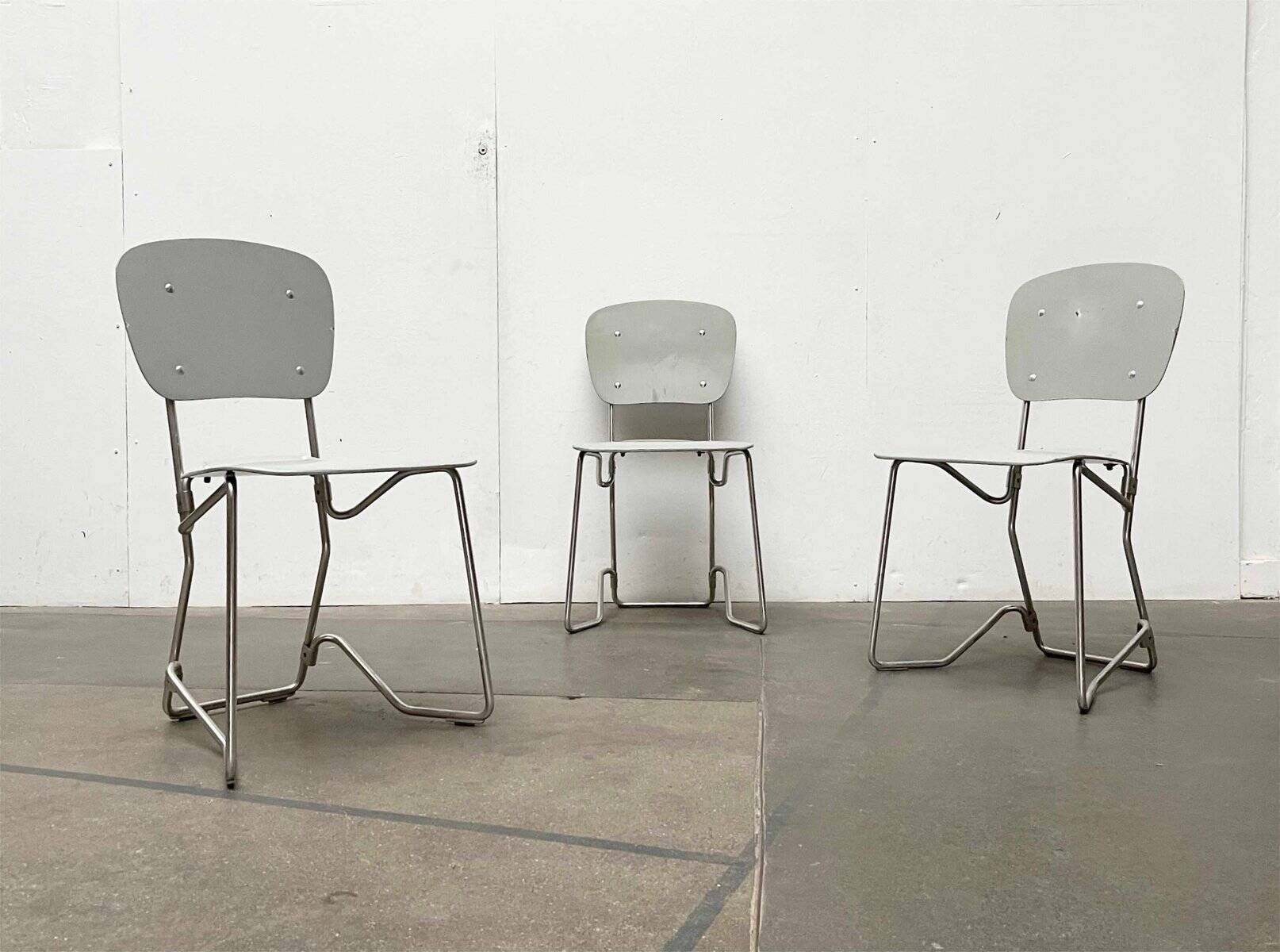 Stackable folding chair in space age style from the mid-century by Armin Wirth for Aluflex, 1960s, set of 3.