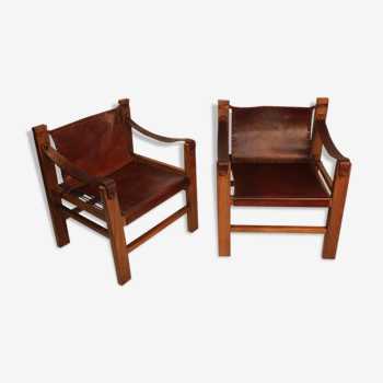 Paire de fauteuils vintage Safari en cuir tendu et bois 1950