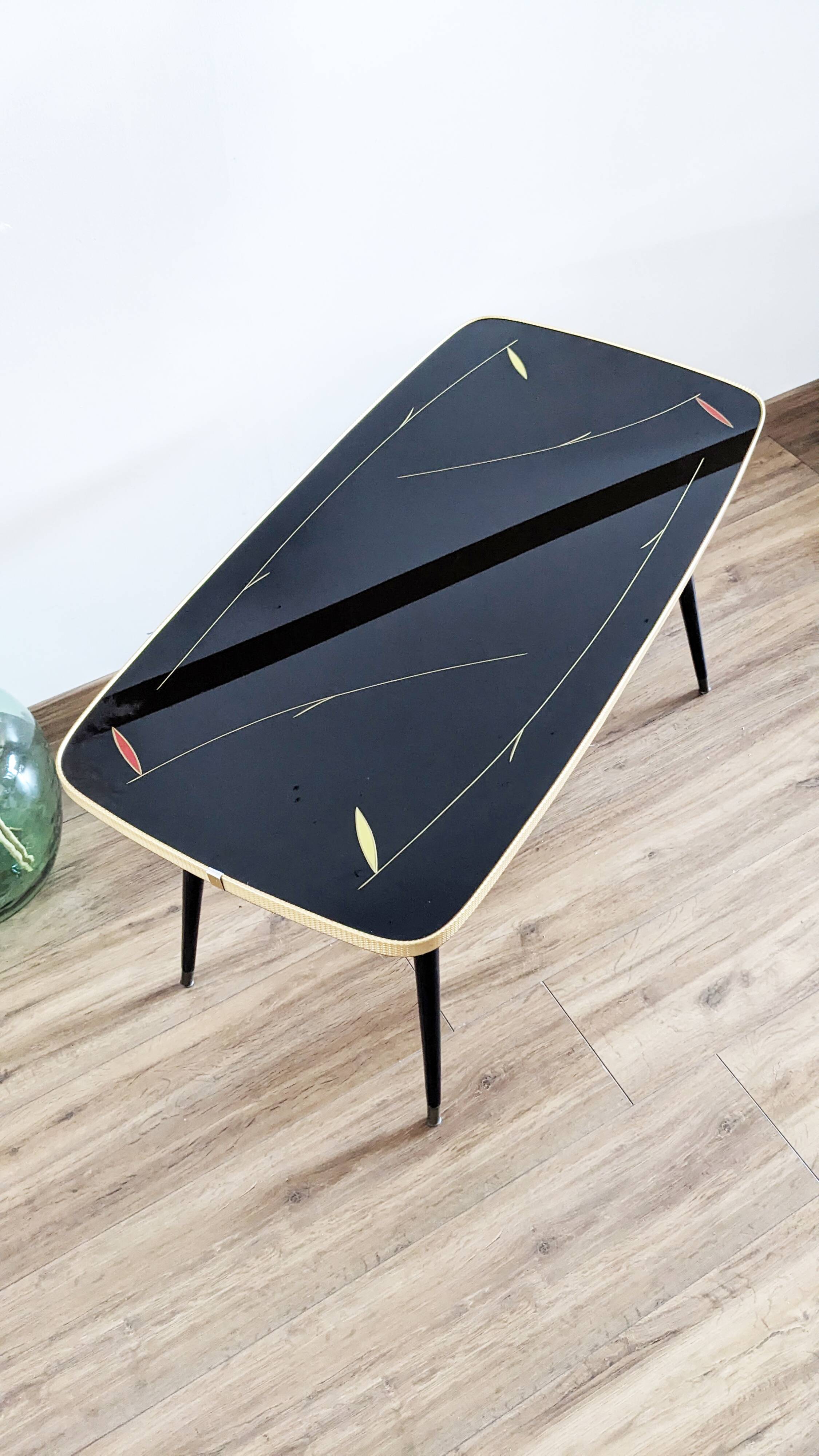 Glass coffee table with spindle legs