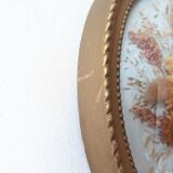 Golden vintage frame with bouquet of dried flowers under globe, wedding bouquet, antique bouquet