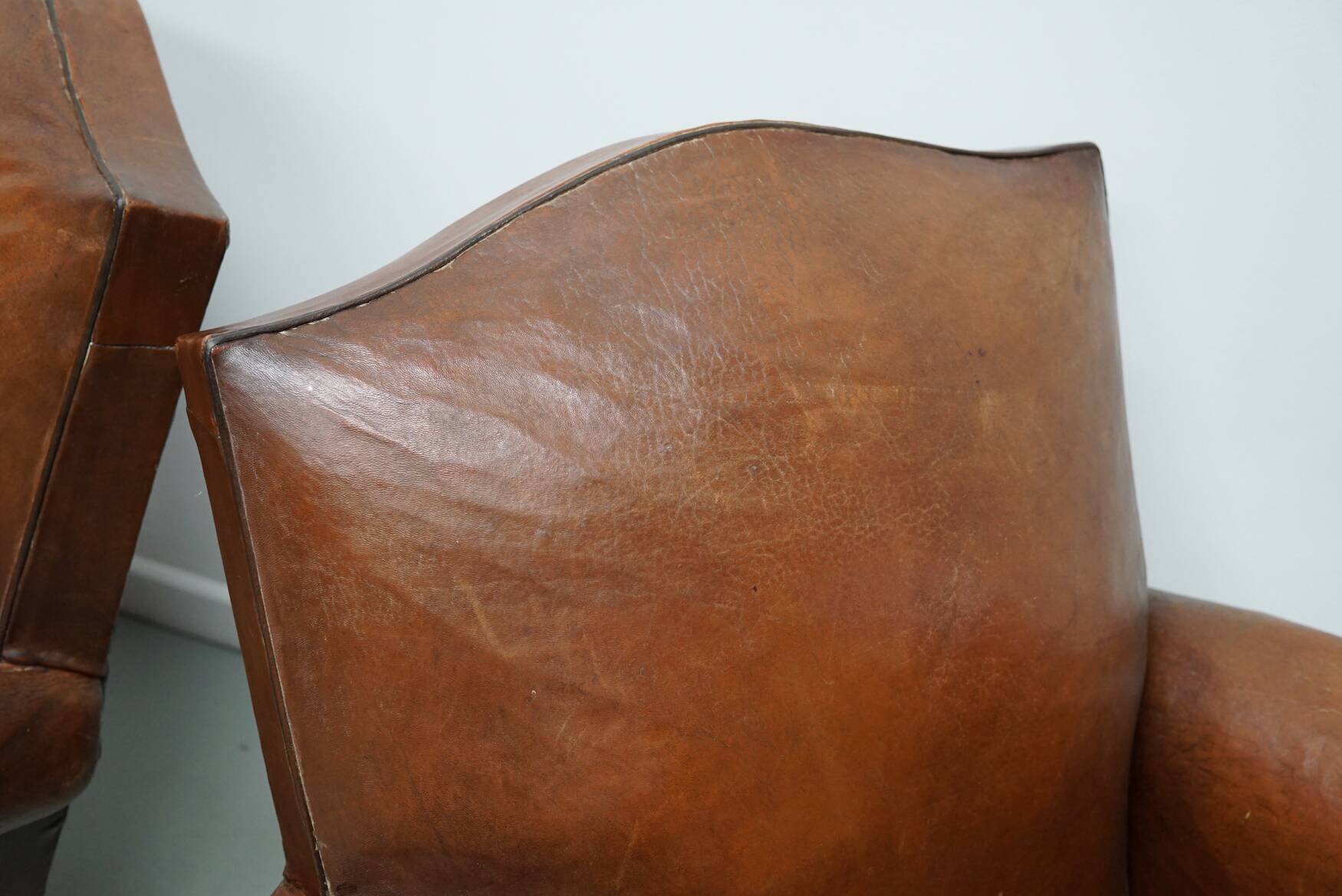 Pair of French Cognac Moustache Back Leather Club Chairs, 1940s