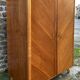 Mid-century wardrobe from the 1960s in wood, with a chevron front and tapered legs.