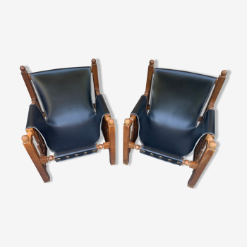 Paire de fauteuil vintage en chêne et skaï noir épais design espagnol 50's