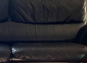 Black leather two-seater sofa