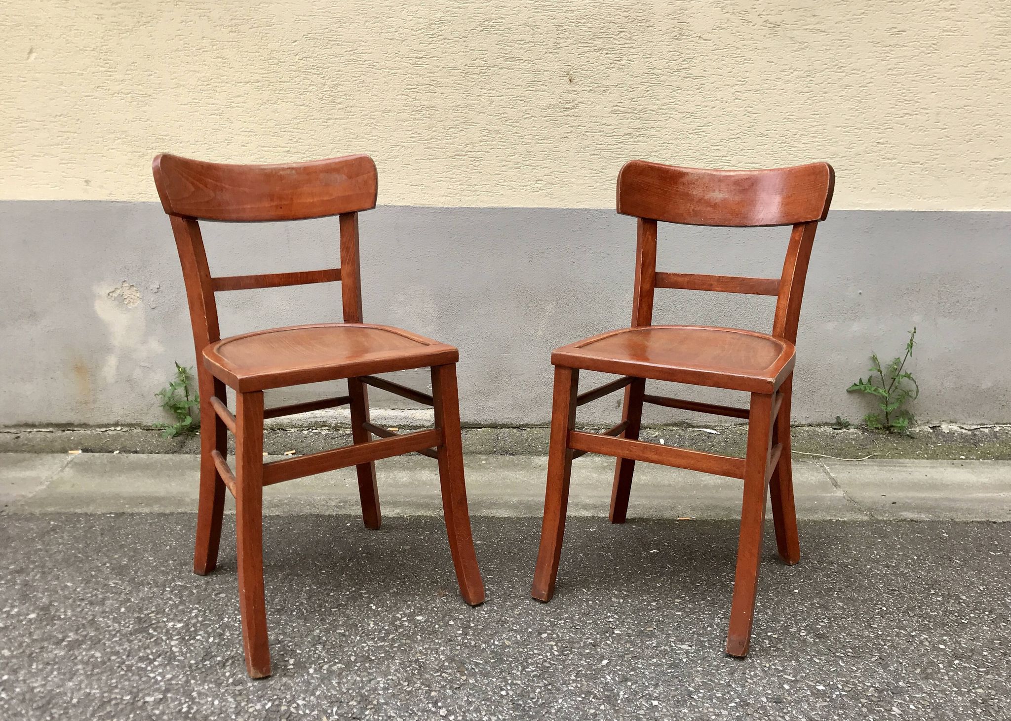 Pair of wooden bistro chairs with orange patina, 1950s