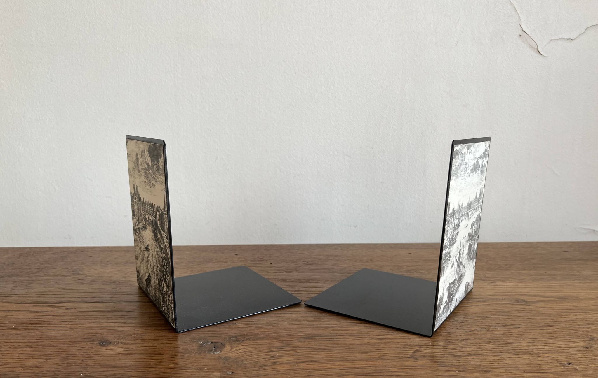 Bookends 1960 between Fornasetti's grey and Toile de Jouy views of Paris.