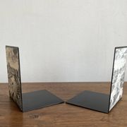 Bookends 1960 between Fornasetti's grey and Toile de Jouy views of Paris.
