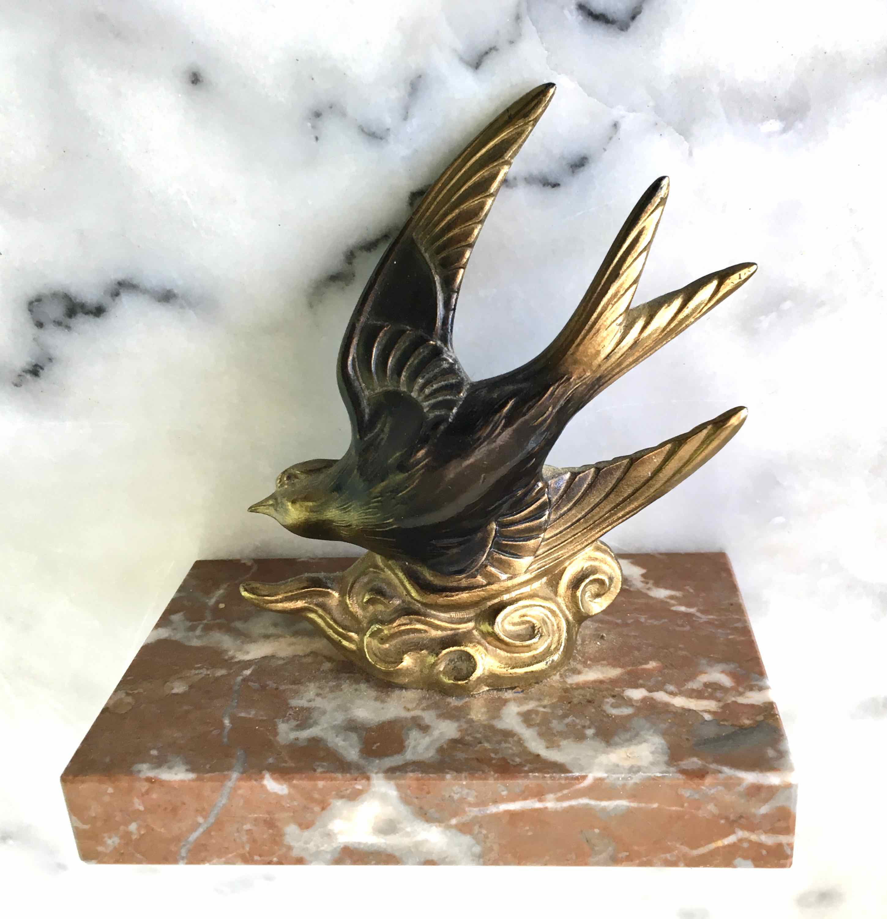 Marble swallow and brass paperweight
