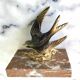 Marble swallow and brass paperweight