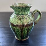 Old pitcher with ethnic decor