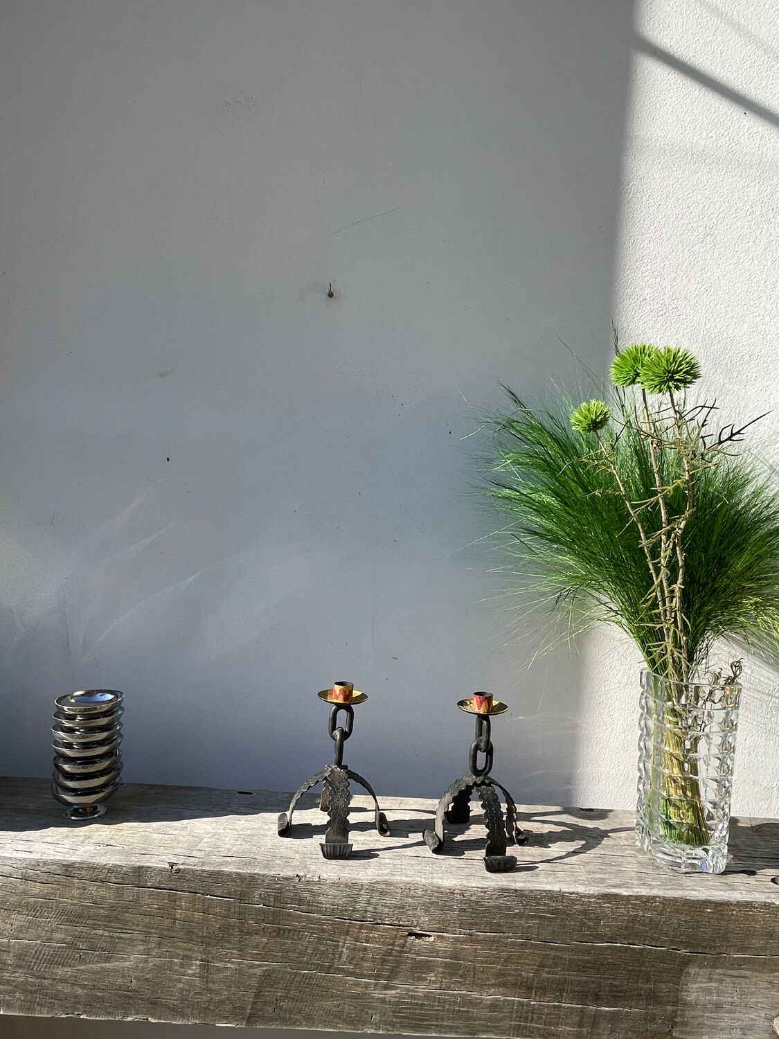 Pair of candlesticks with wrought iron chain