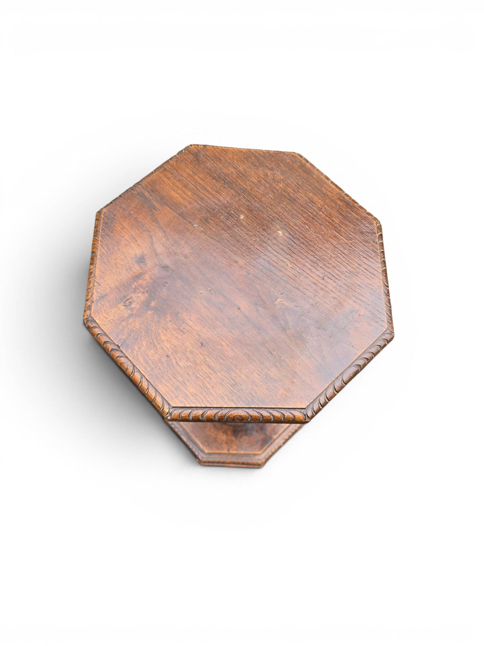 Antique carved solid oak pedestal, octagonal top and turned column.