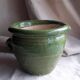 Glazed green terracotta pot.