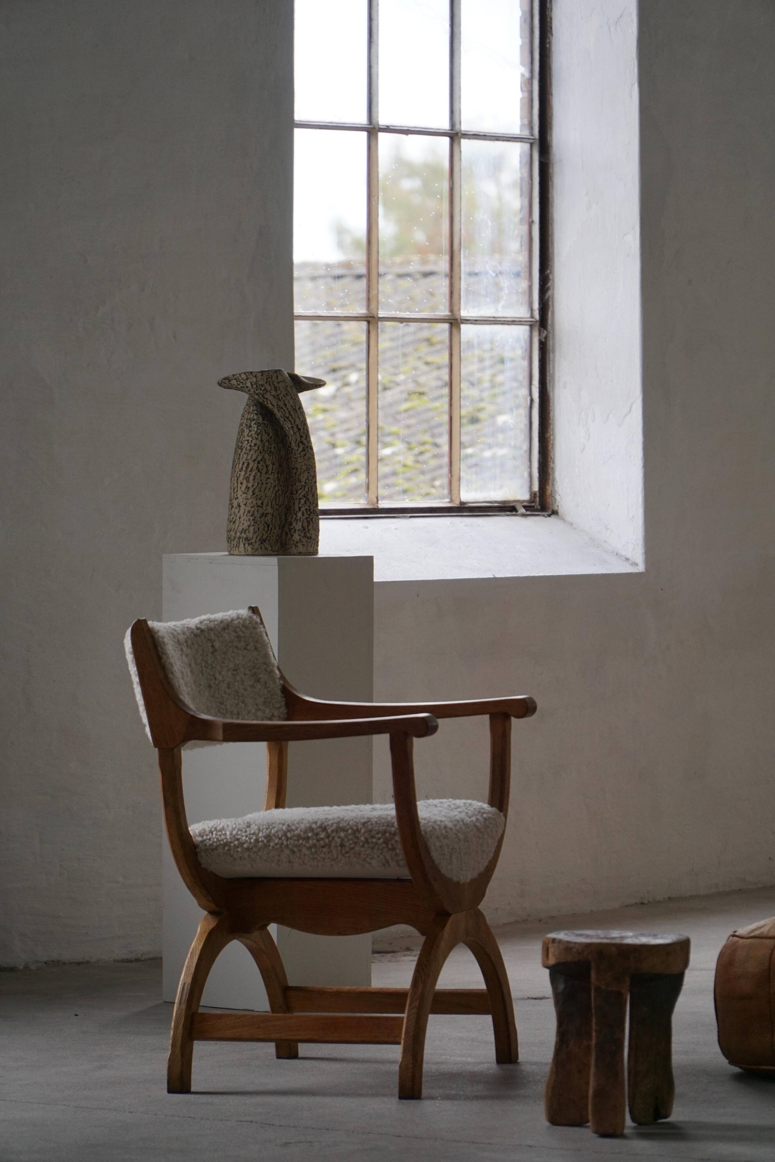 Henning Kjærnulf, Oak and lambswool armchair, "Kurul" model, Mid-century, 1960s