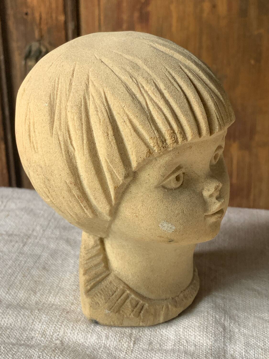 Stone bust of a little girl