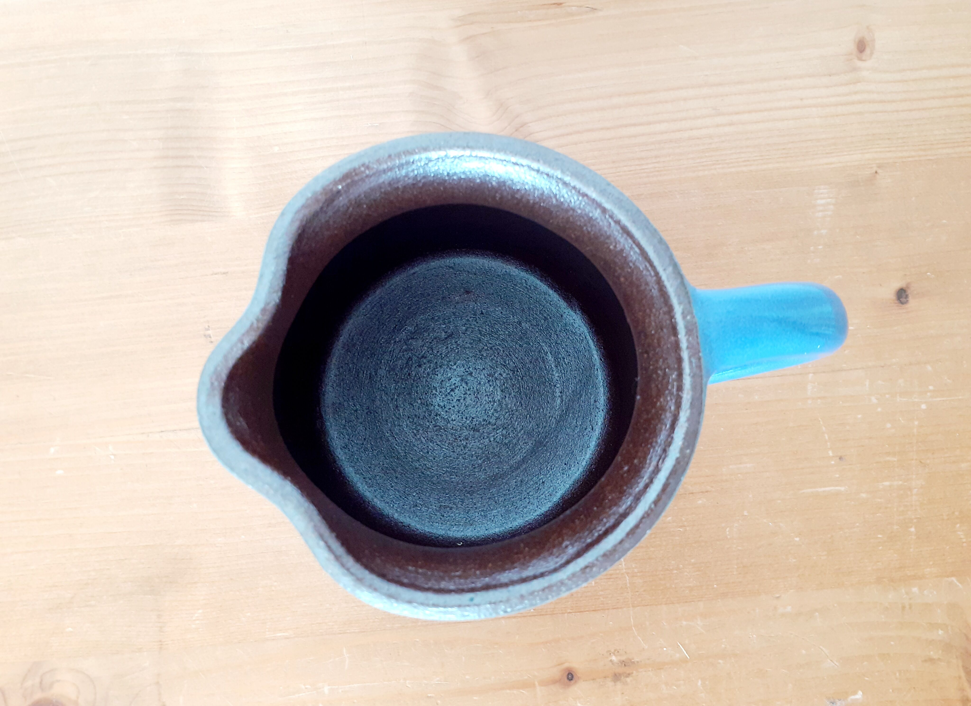 Old glazed blue sandstone pitcher